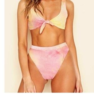 Super cute tie dye dipping daisy swimsuit.Bottoms are not high waisted.